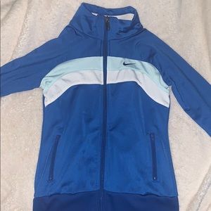 A blue and white Nike Tracy jacket.